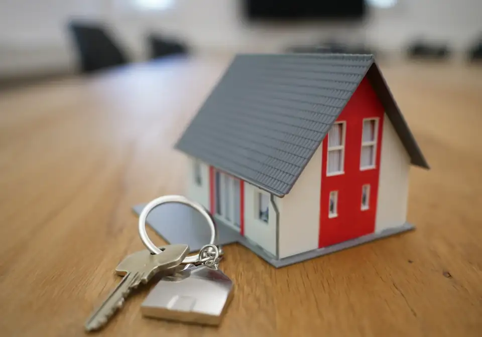 House keys with a model home on a table